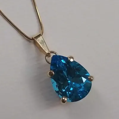 Pingente gota topázio azul folheado a ouro